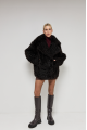 Double-sided curly sheepskin coat in dark chocolate color made of natural sheepskin in OVERSIZE style